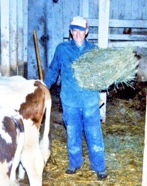 Uncle Douglas with hay flakes to feed