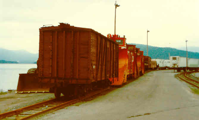 Newfoundland Railway wooden boxcar, snowplows at Corner Brook