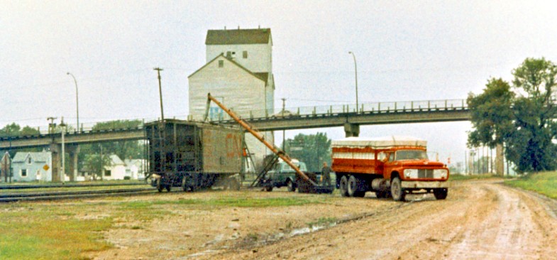 Loading grain by auger at CNR Portage.