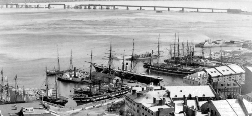 Montreal
                harbour and Victoria Bridge construction 1859